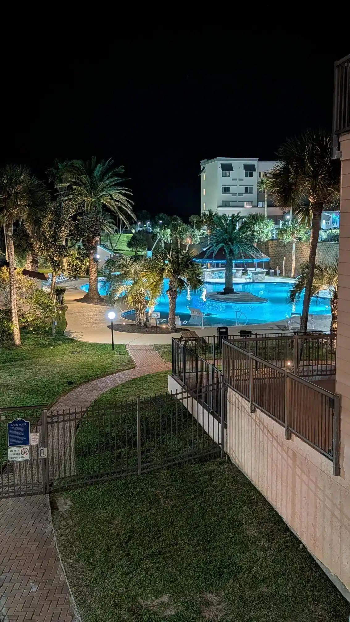 Image 1: West pool at night - your view from the balcony