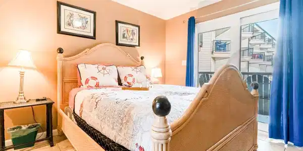 Image 4: Primary Bedroom with queen bed