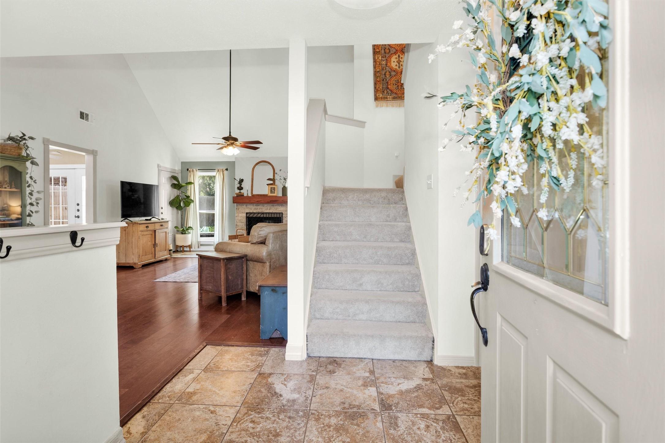 Image 3: Bright entryway welcomes family and guests.
