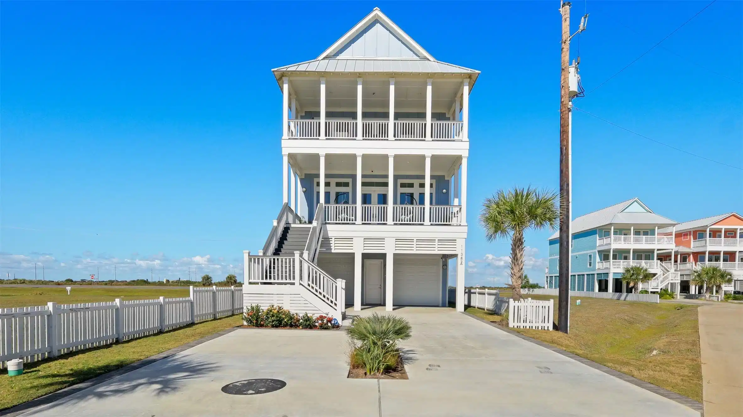 Image 1: A charming, elevated coastal home with a spacious