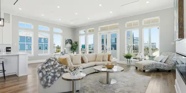 Image 2: This spacious, modern living room features abundan