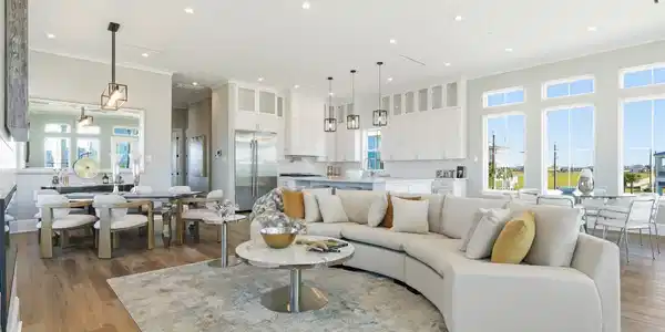 Image 4: This spacious, open-concept living area features a