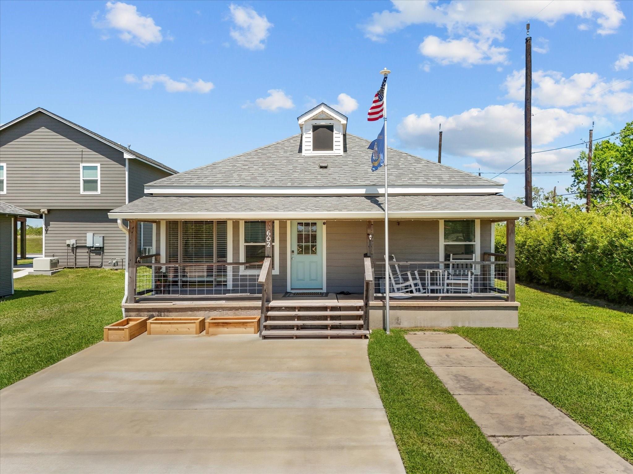 Image 1: Charming single-story home with a welcoming front