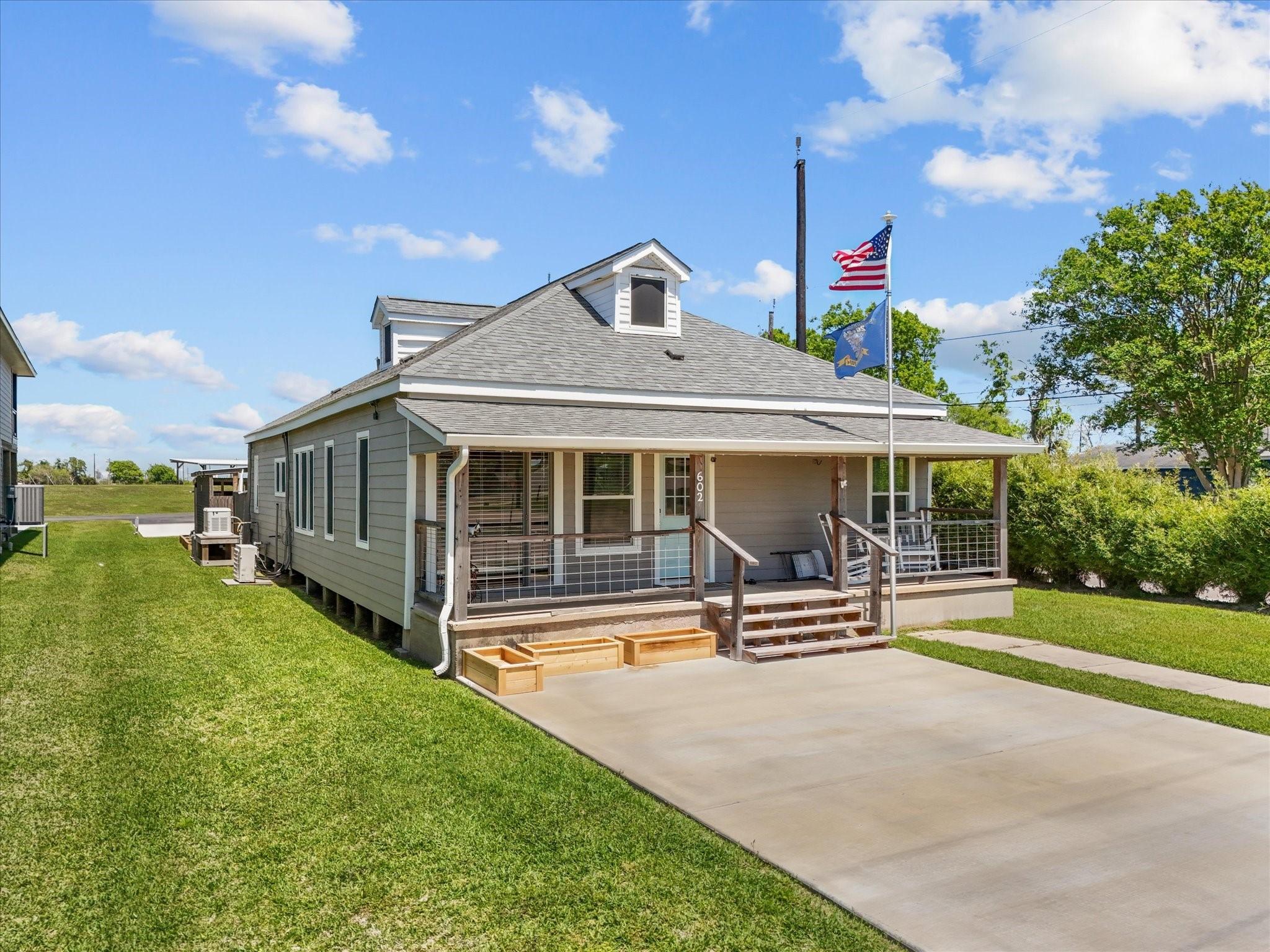 Image 2: Charming single-story home with a welcoming front