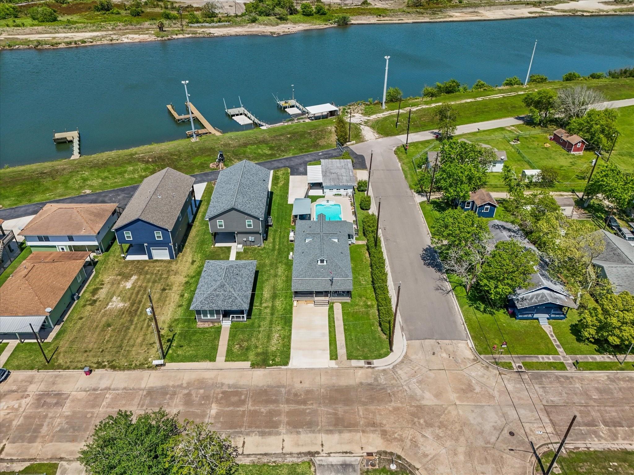 Image 3: This aerial view shows a charming neighborhood wit