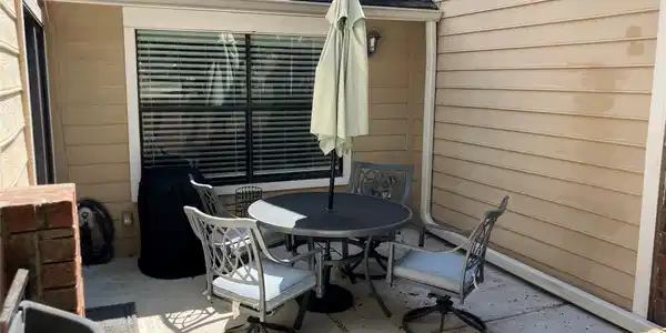 Image 3: Charming patio area with cozy seating, perfect for