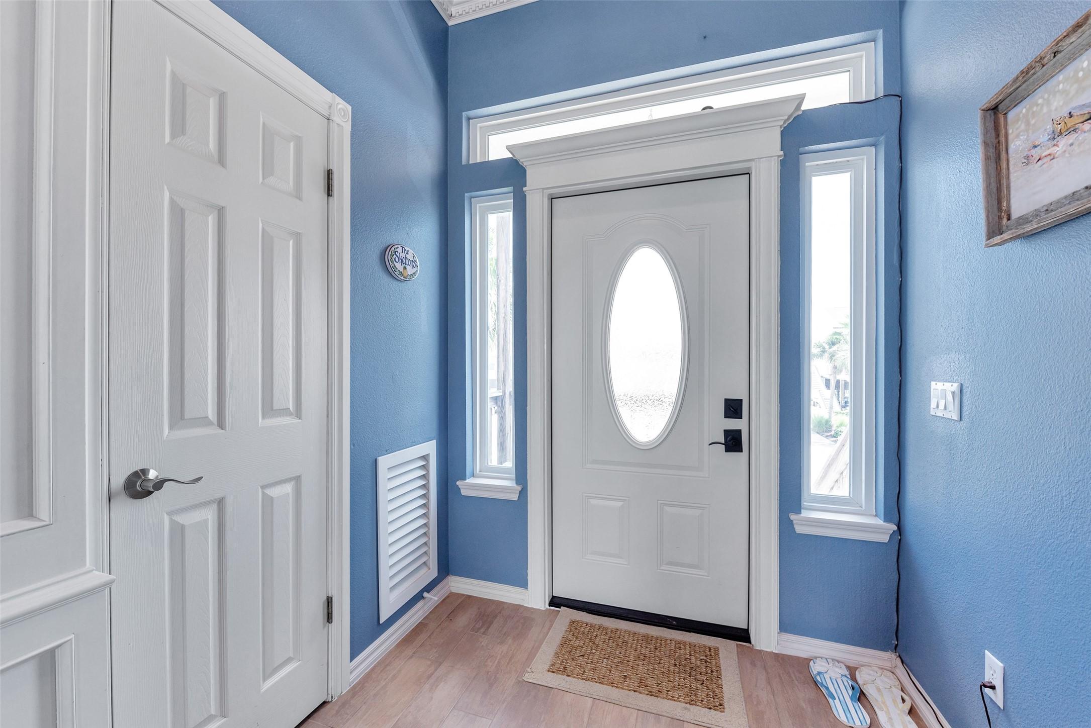 Image 4: Step inside to a bright and welcoming entry and a