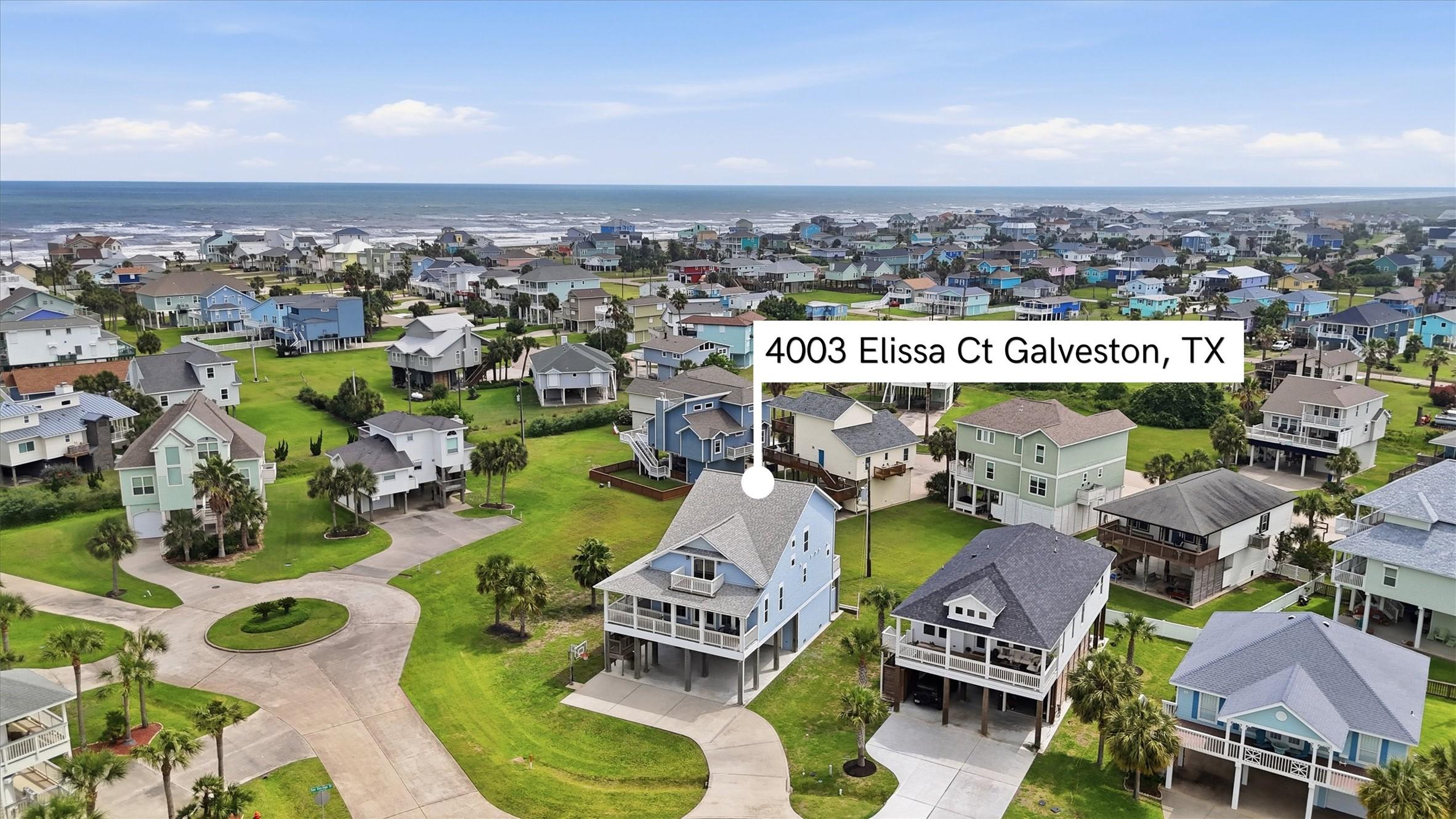 Image 2: Aerial view capturing property and adjacent coasta