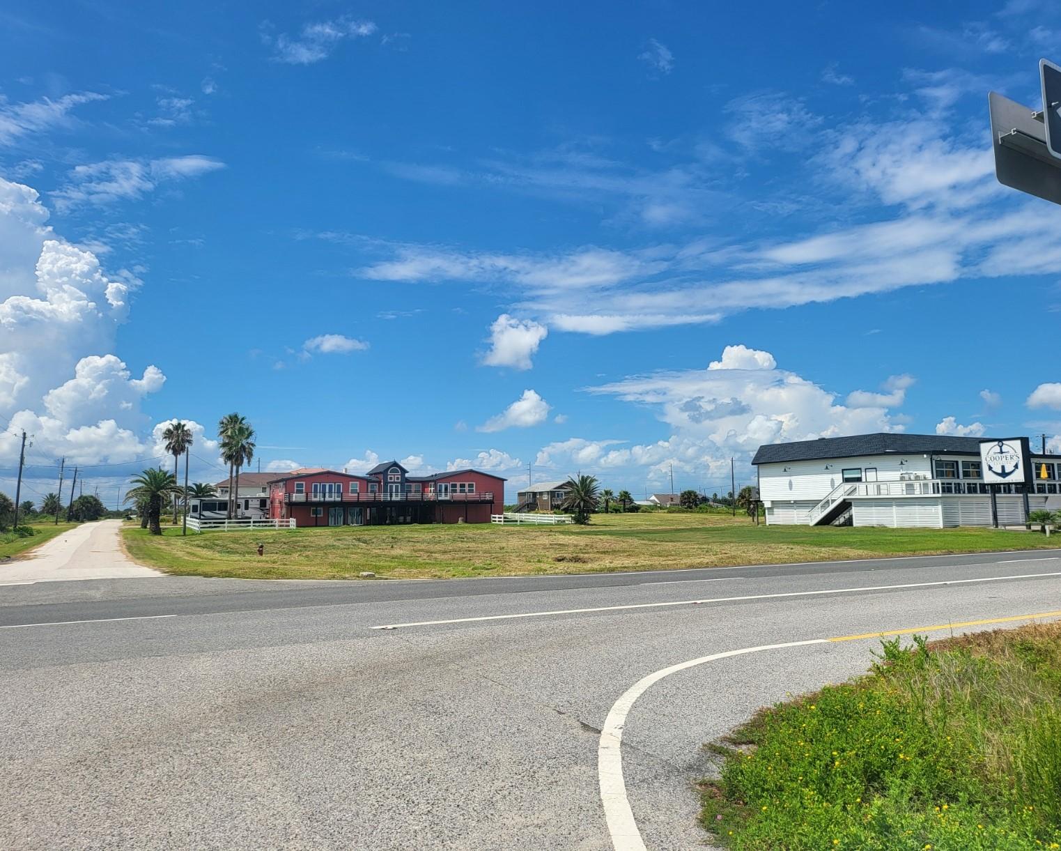 Image 1: This highly visible corner lot is zoned Commercial