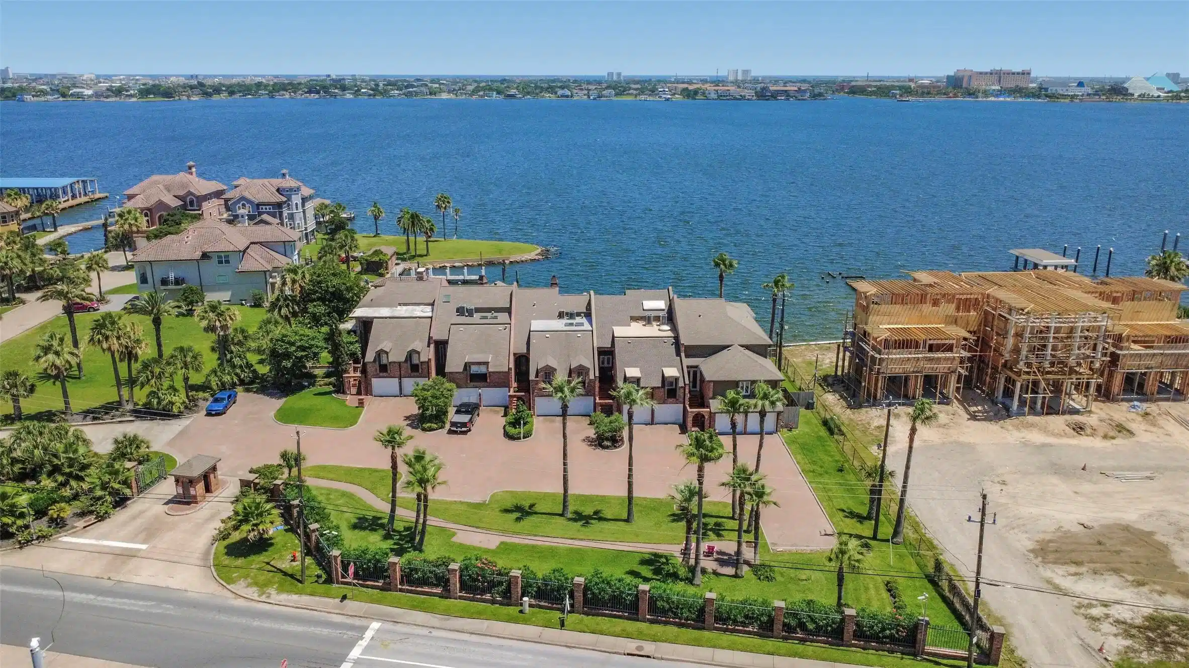 Image 1: This waterfront property features a row of attache