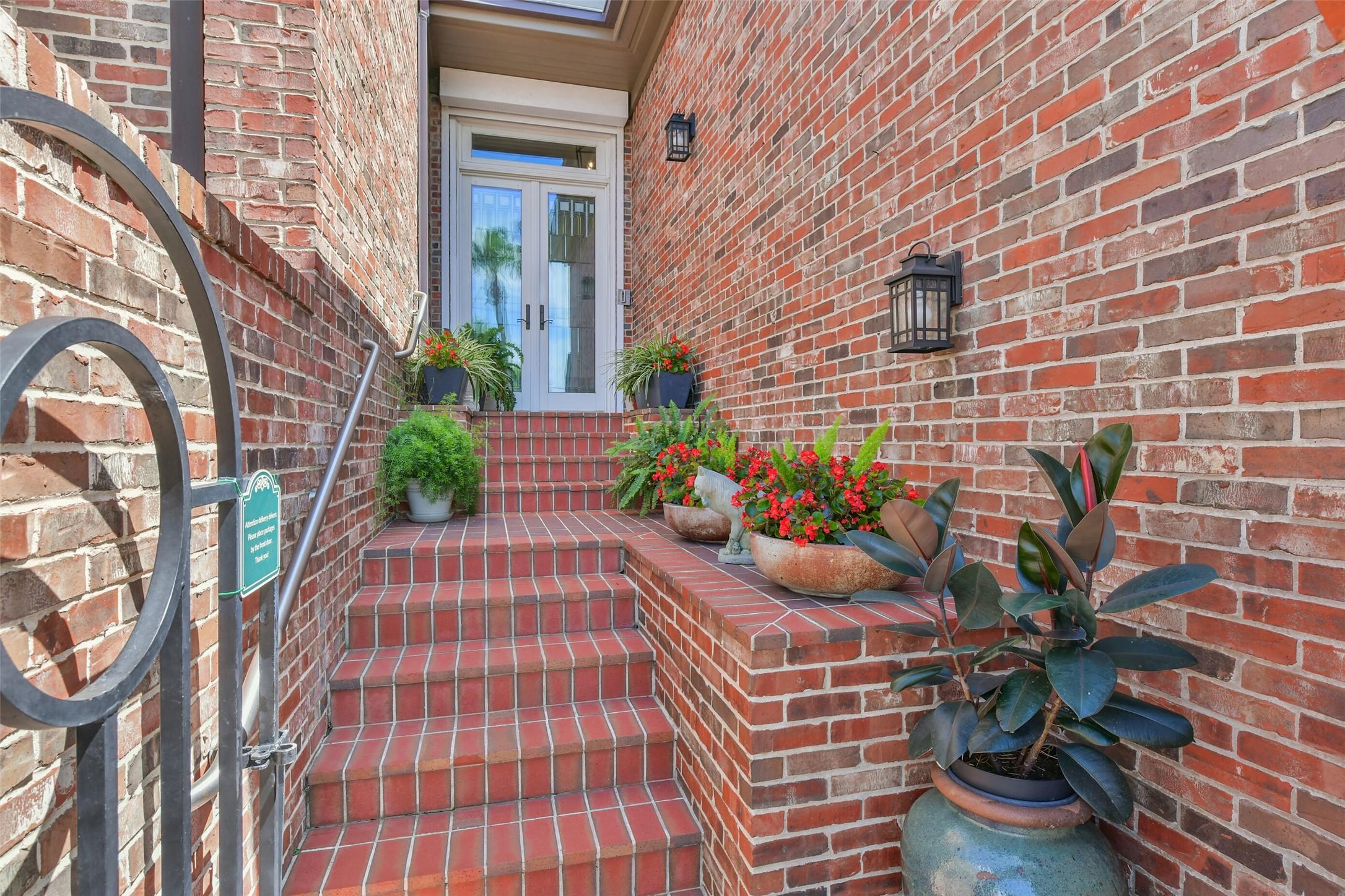 Image 4: This photo showcases an inviting brick entryway wi