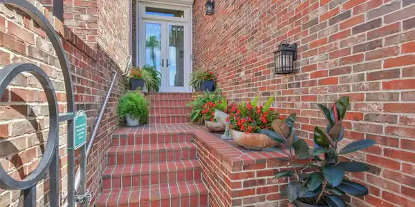 Image 4: This photo showcases an inviting brick entryway wi