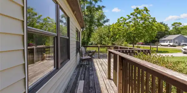 Image 3: This photo showcases a charming wooden deck attach