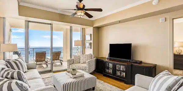 Image 3: Bright living area with direct balcony access and