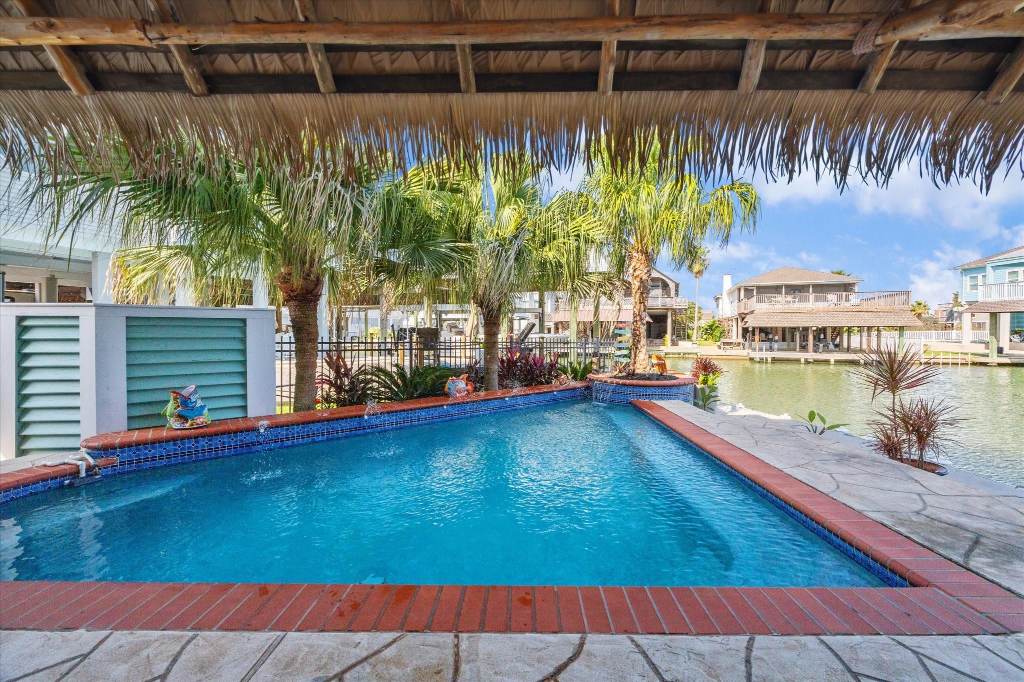 Image 2: Welcome to your outdoor oasis with a heated pool o