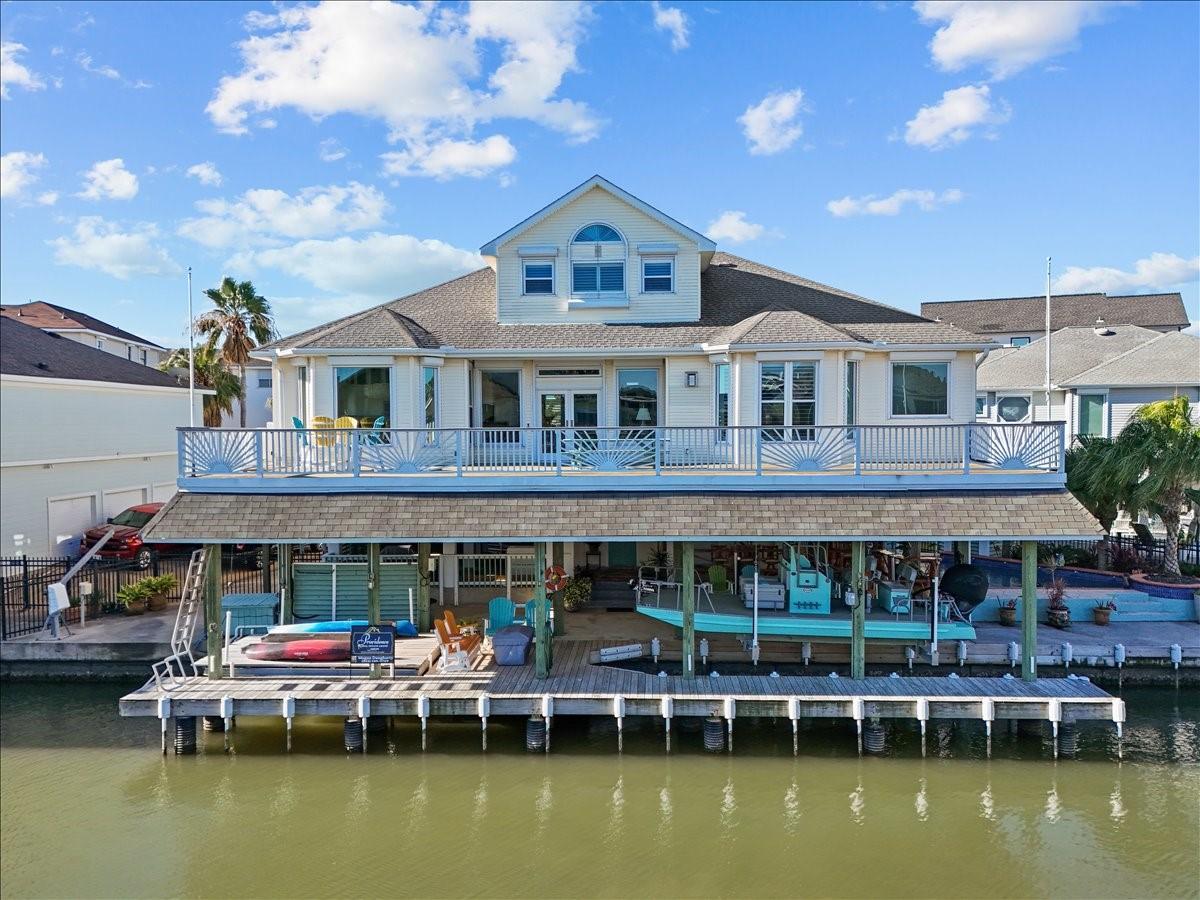 Image 3: This canal front home in the community of Tiki Isl