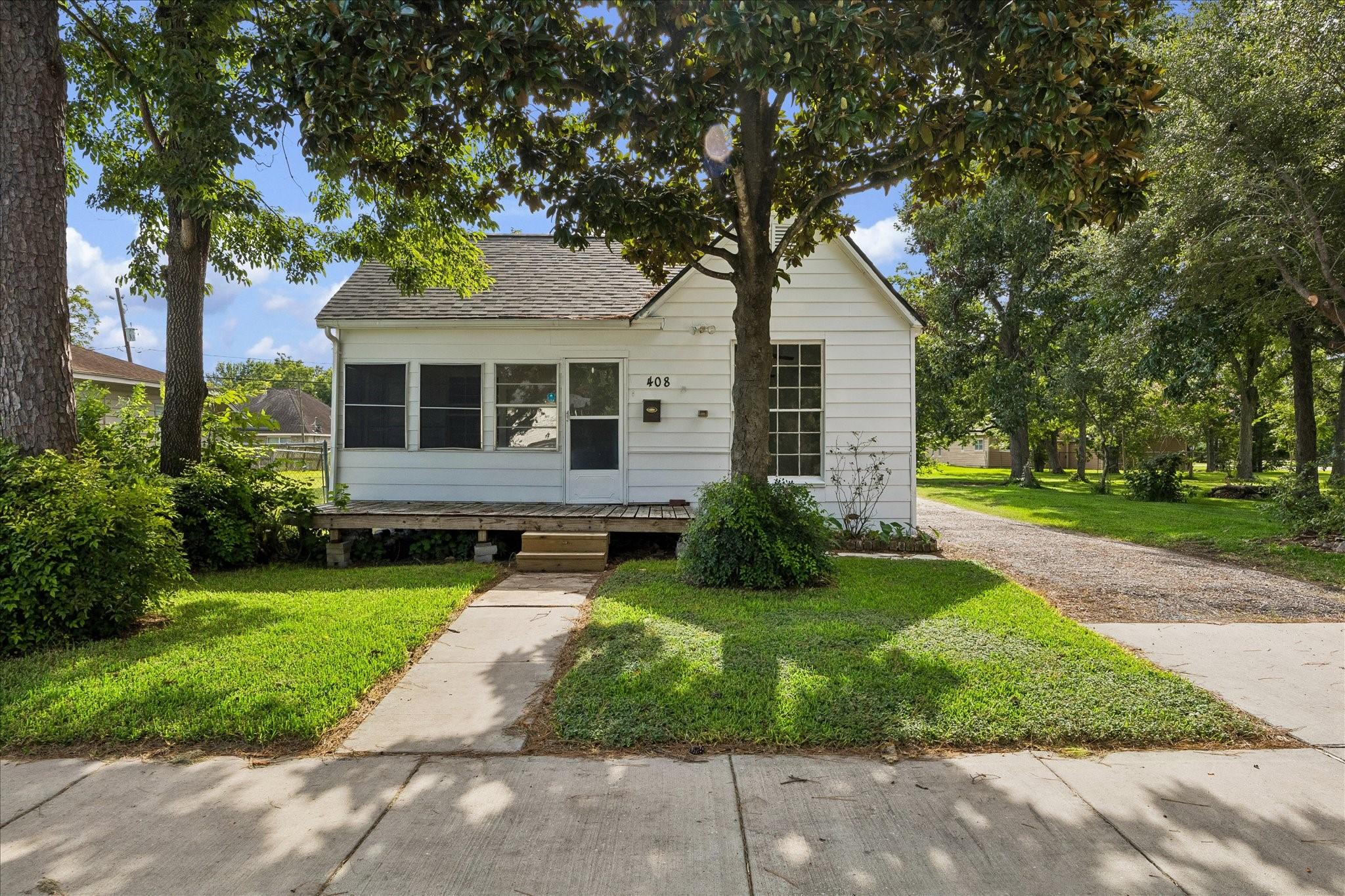 Image 1: Welcome to 408 S 4th St. The front of the home fea