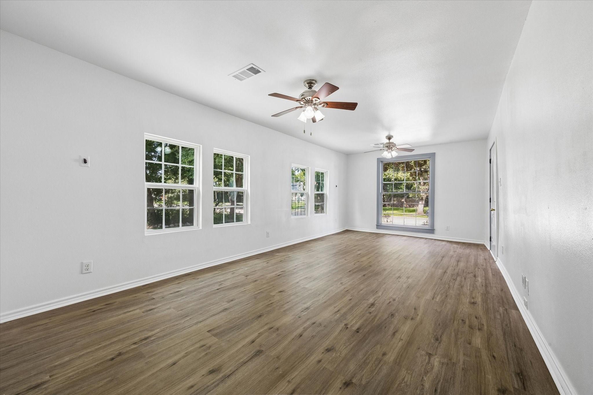 Image 3: Living/dining combo, view from the kitchen looking