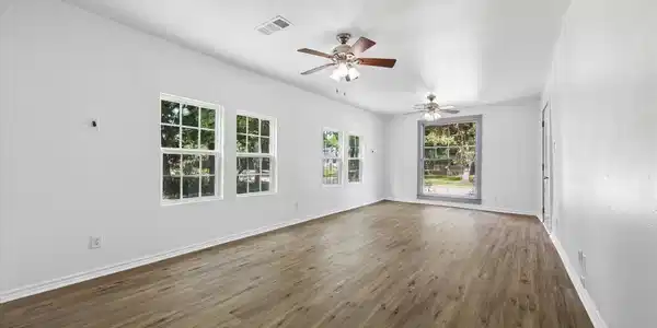 Image 3: Living/dining combo, view from the kitchen looking