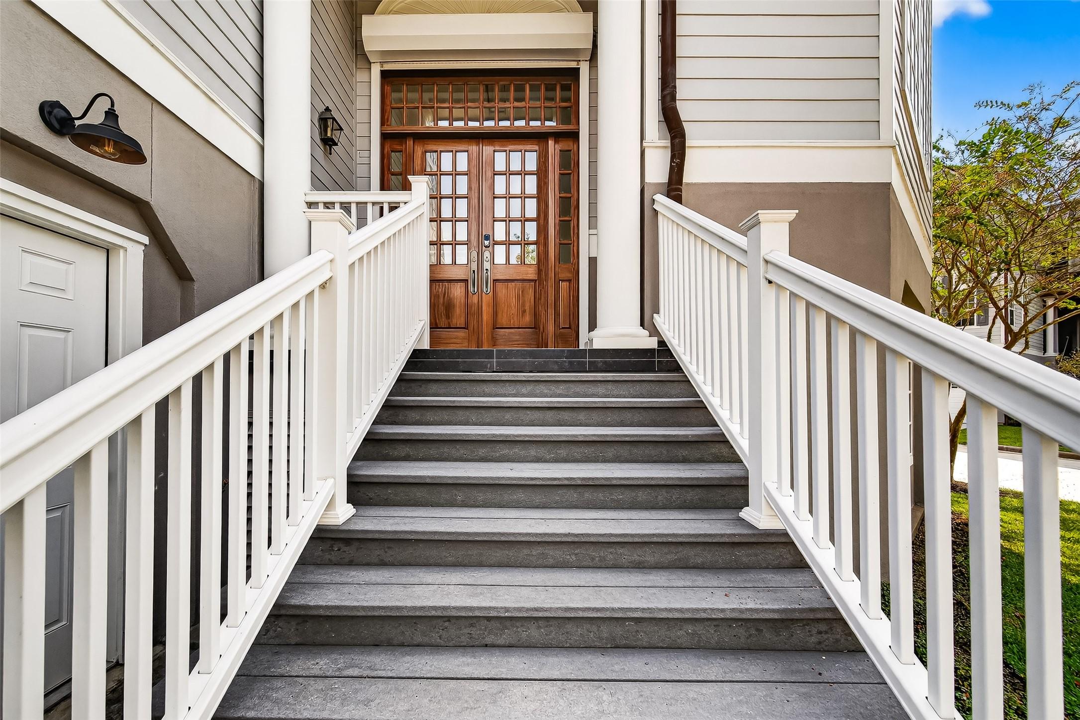 Image 4: Entryway leading up to stunning wood front double