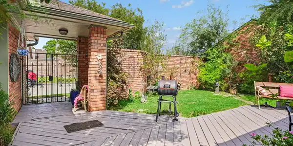 Image 4: Expansive multi-level patio with fresh paint and g