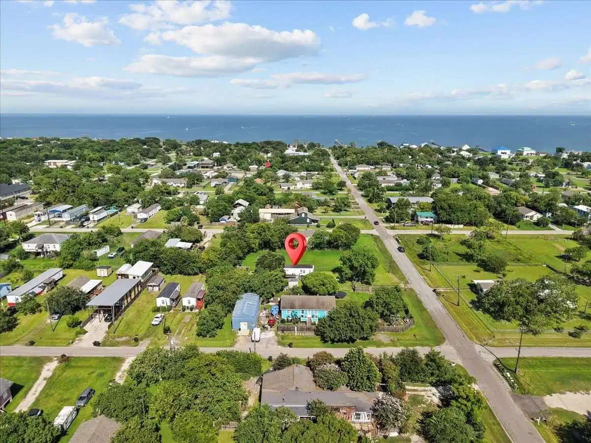 Image 1: Aerial view highlights a residential lot indicated