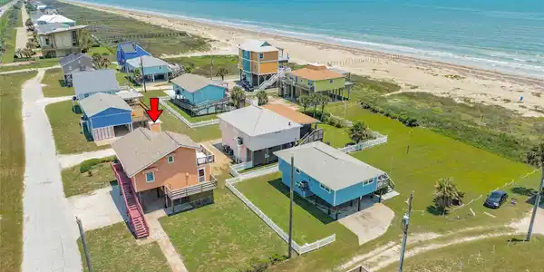 Image 2: Facing East with side vie of home.