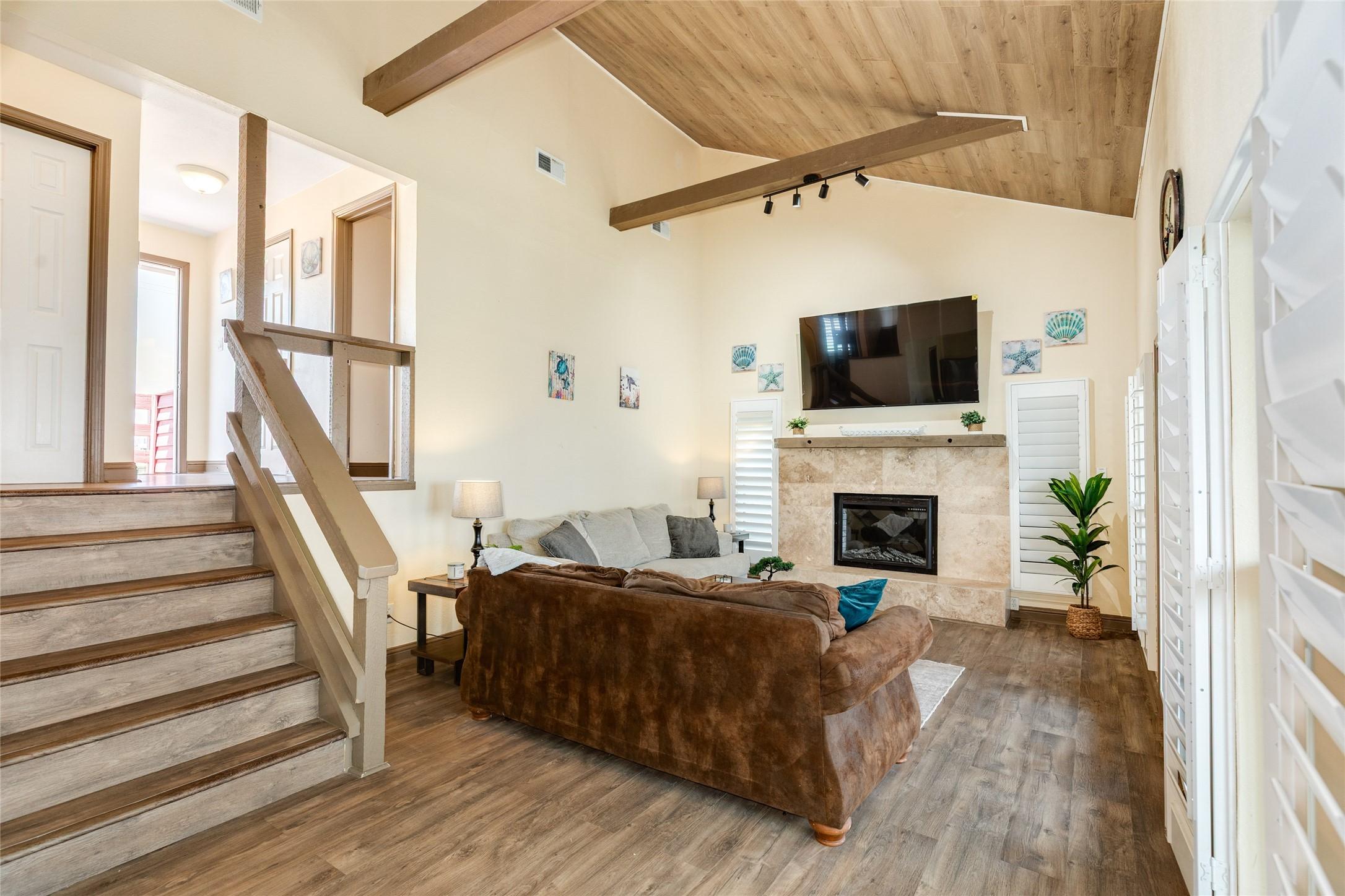 Image 3: Spacious family/living area with fireplace.  Beaut