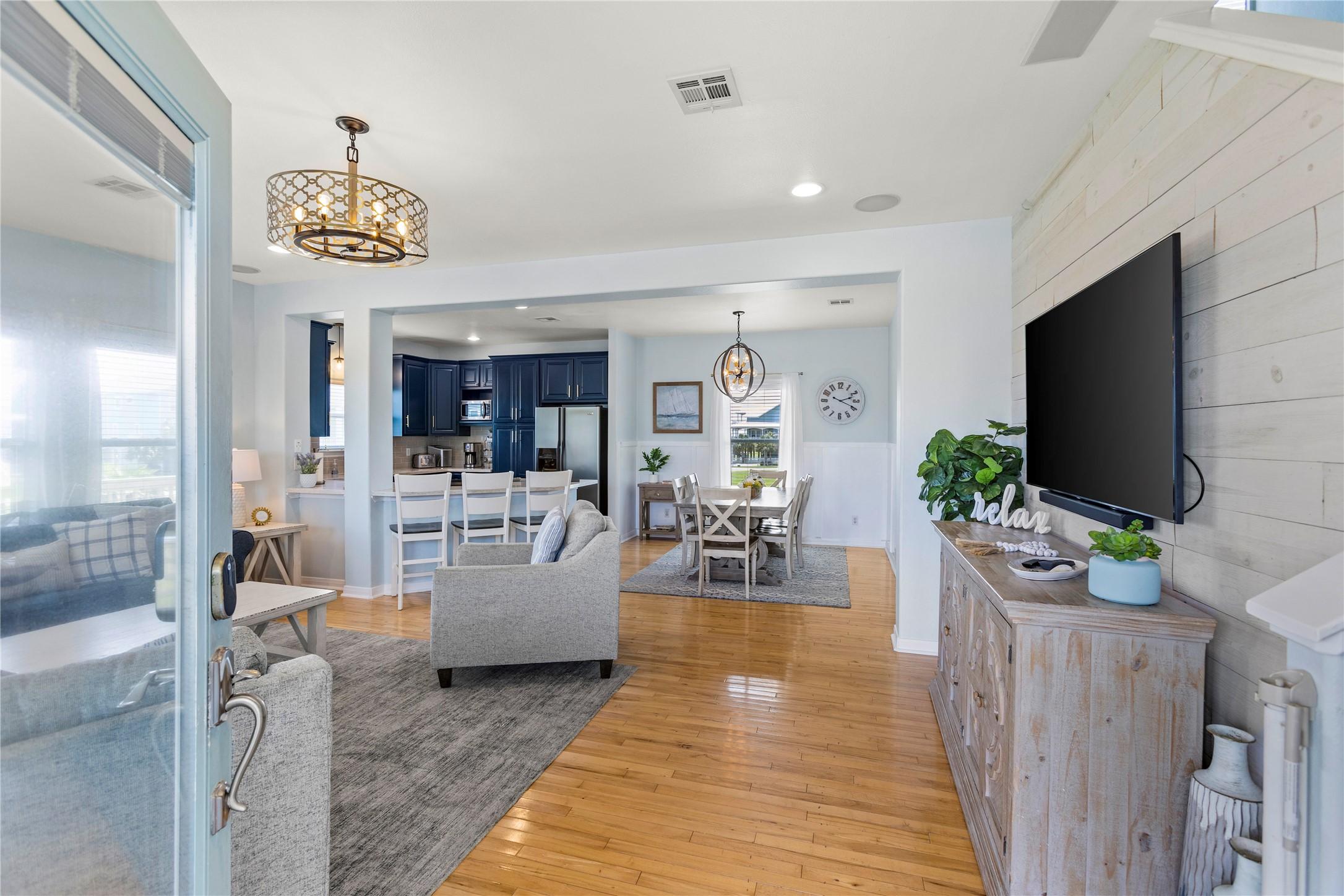 Image 4: View from the front door into the open living and