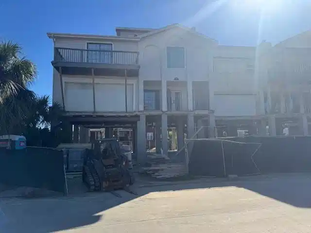 Image 1: Front view of the home currently being professiona