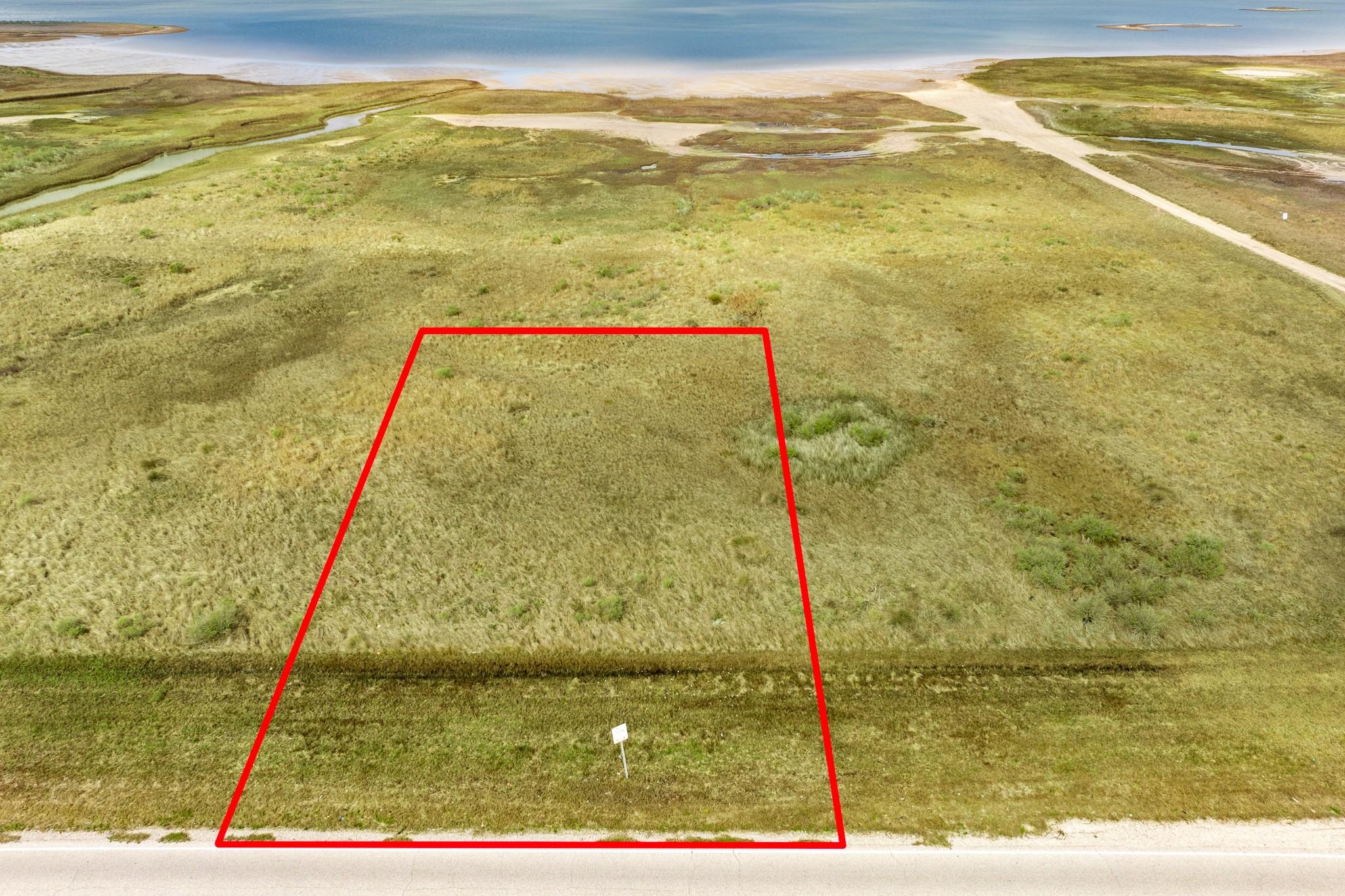 Image 2: Cleared beachfront lot with direct road frontage a