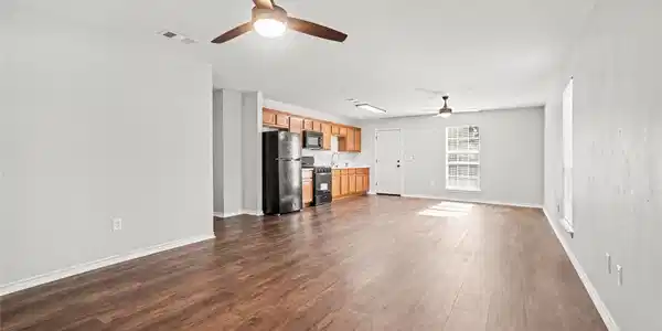 Image 2: This photo showcases a spacious, open-concept livi