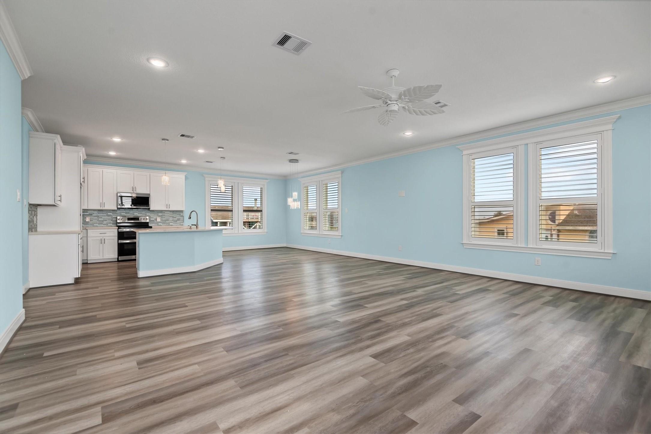 Image 4: Great room open to kitchen and breakfast room