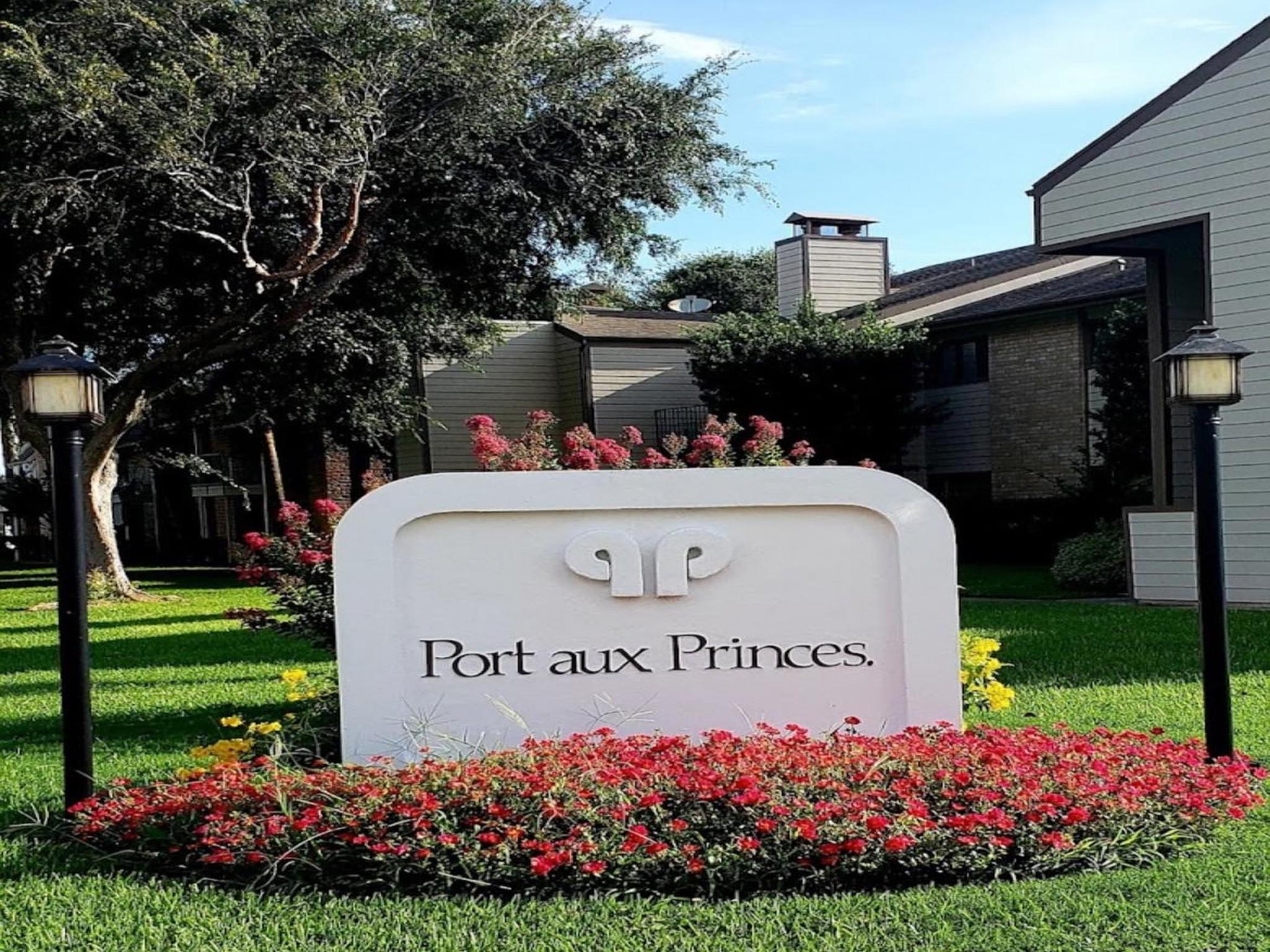 Image 2: Community entrance sign with landscaped grounds.