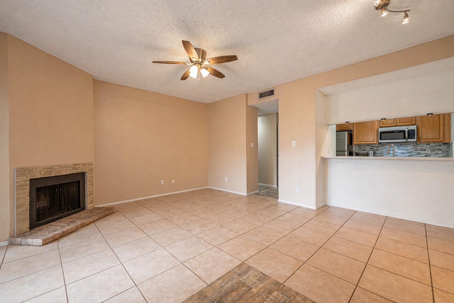 Image 4: Living, dining areas featuring tile flooring and a