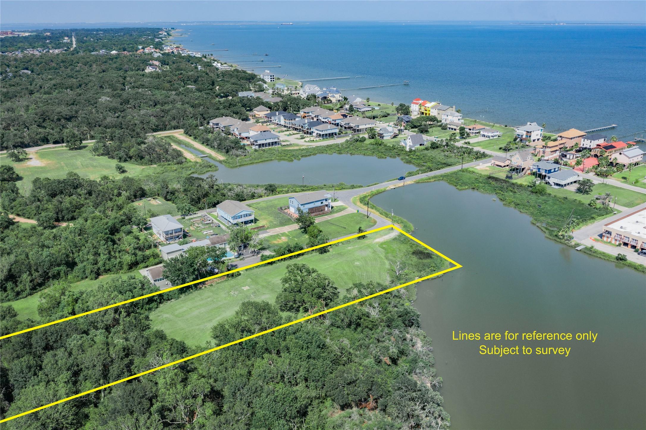 Image 3: This aerial photo showcases a spacious waterfront