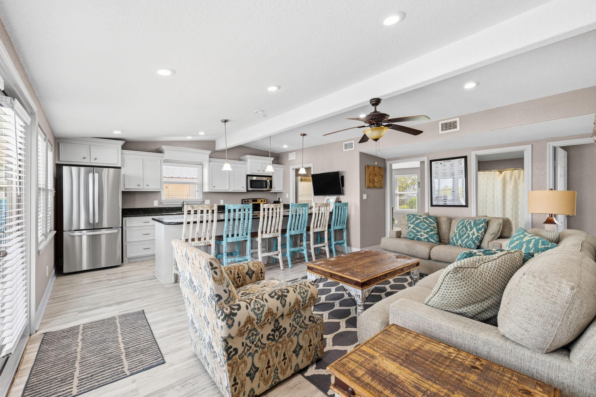 Image 4: Step inside to a bright, open living space that fl