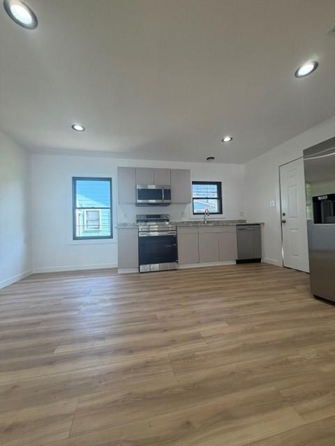 Image 3: This photo showcases a modern kitchen with stainle