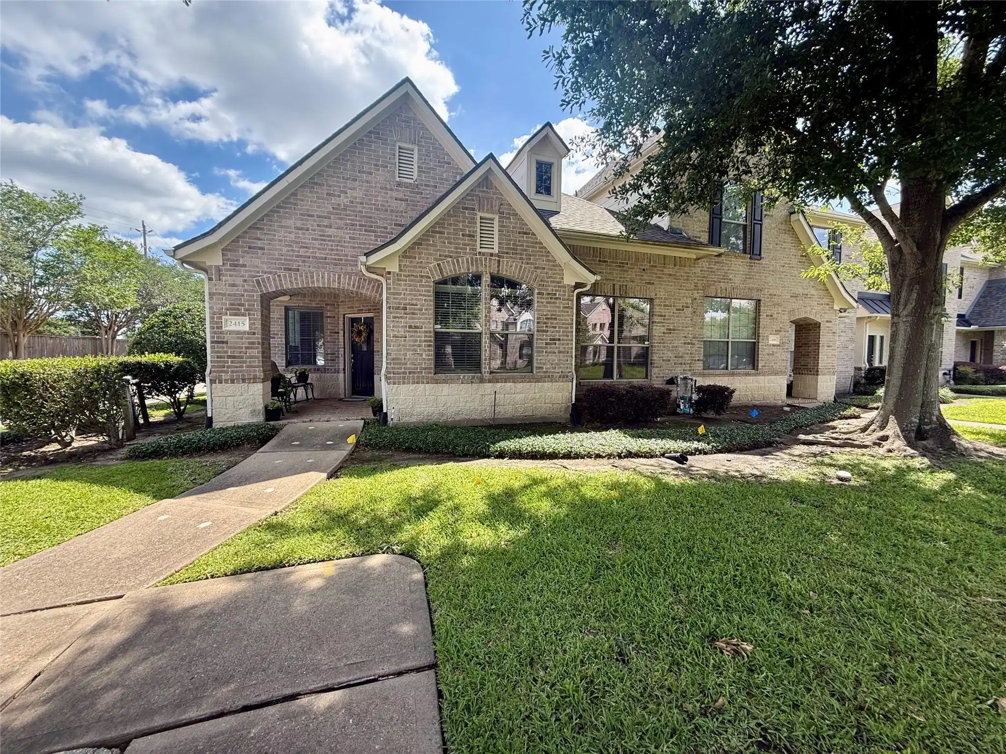 Image 1: Charming brick townhome with single-level living,