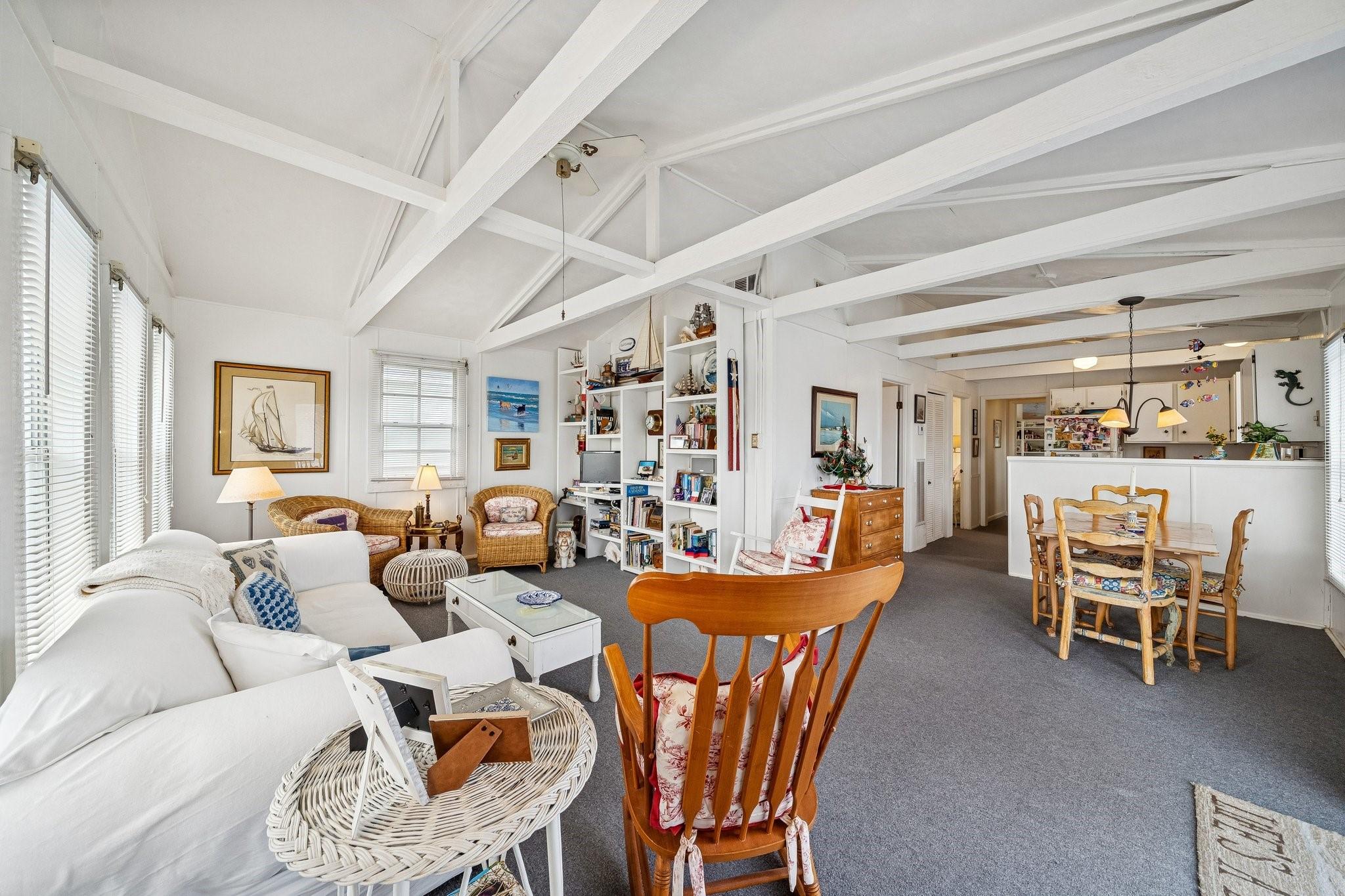 Image 3: A cozy coastal retreat featuring built-in shelving