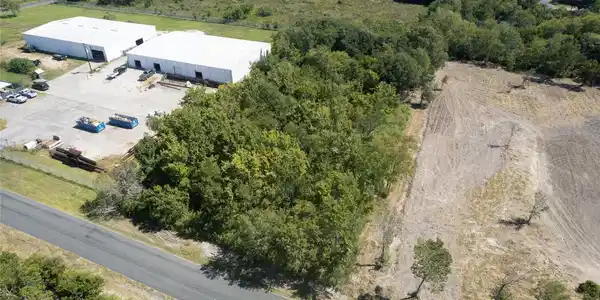 Image 2: Drone showing wooded property