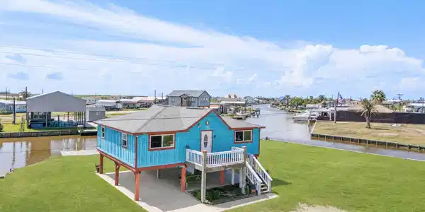 Image 2: Front and back upstairs decks along with covered p