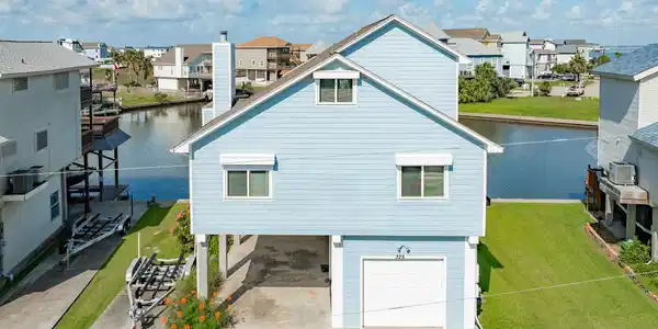 Image 2: Property has a double wide driveway, parking under