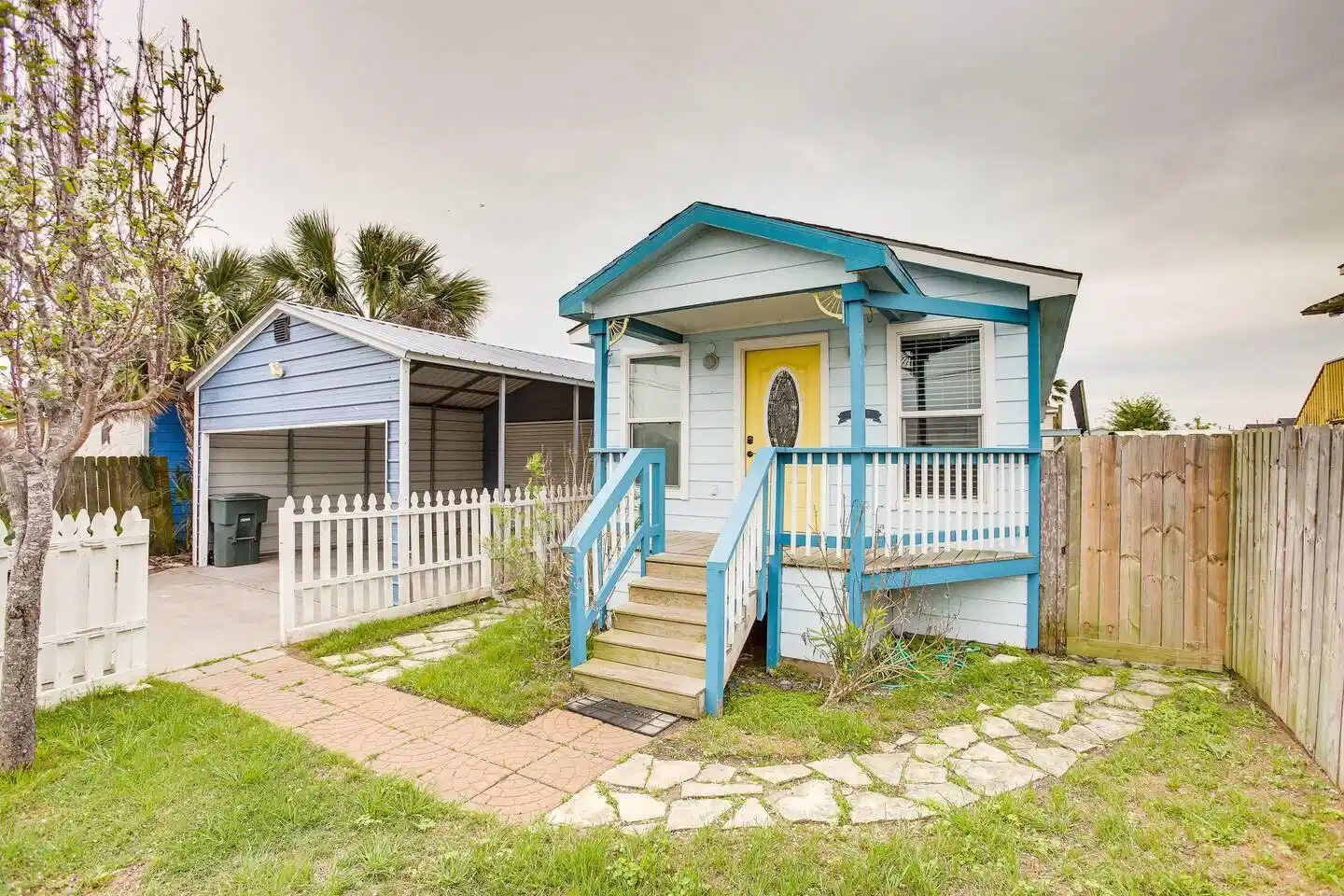 Image 1: A charming front exterior view of the home, featur