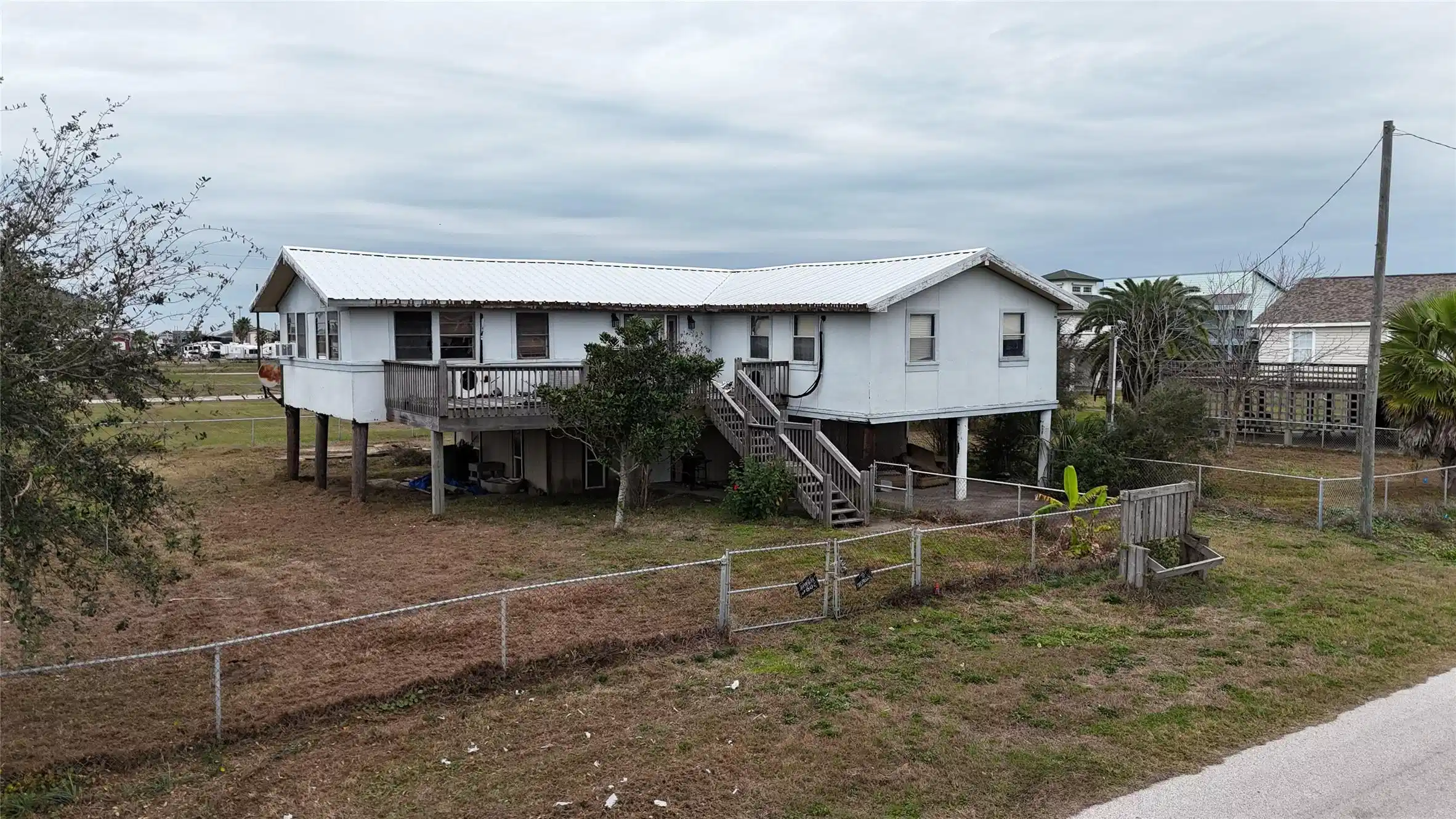Image 1: This fixer upper offers over 2,000 sq ft and a gen