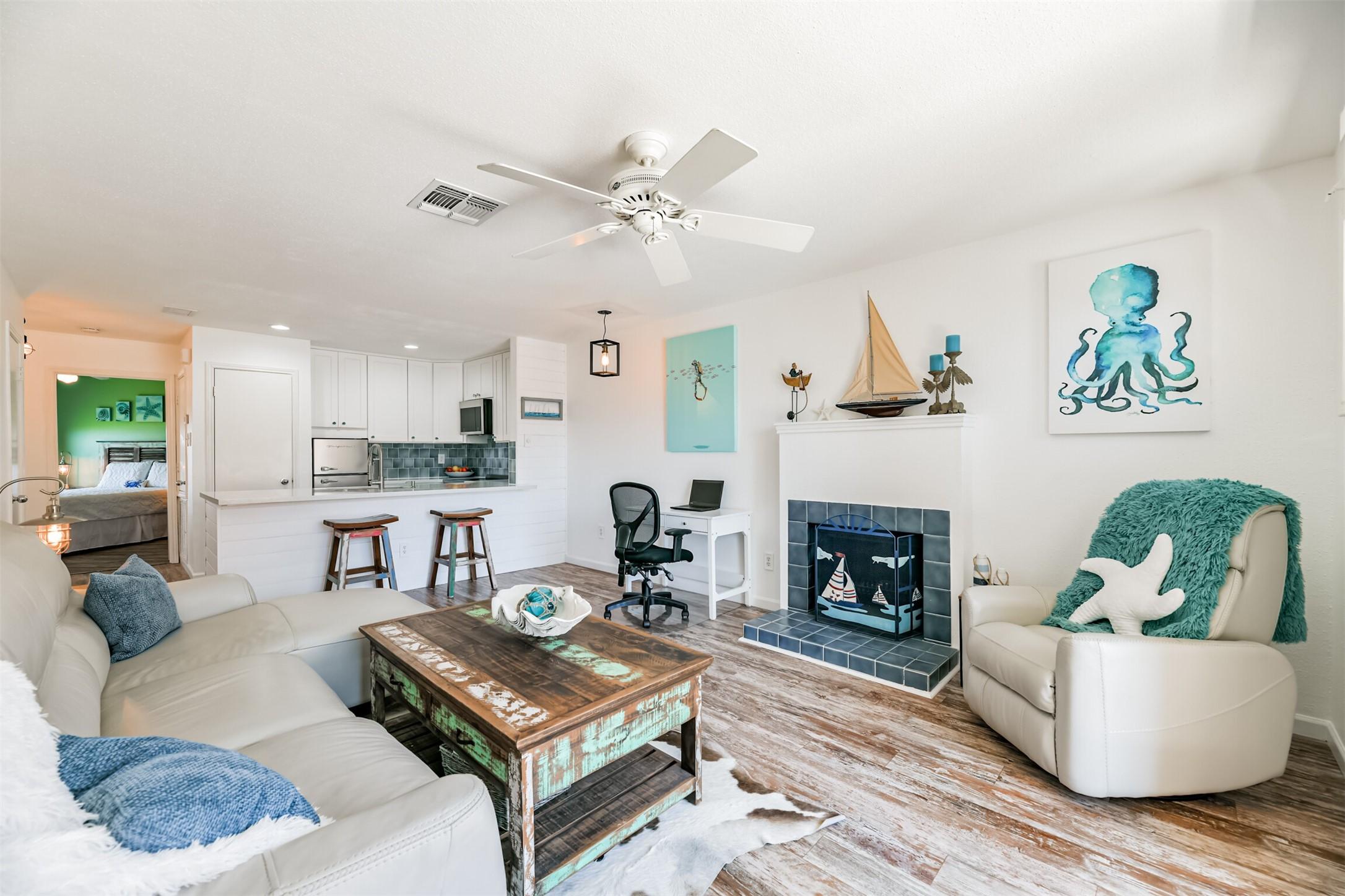 Image 2: Open concept coastal living room and kitchen