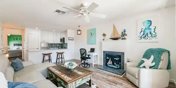 Image 2: Open concept coastal living room and kitchen