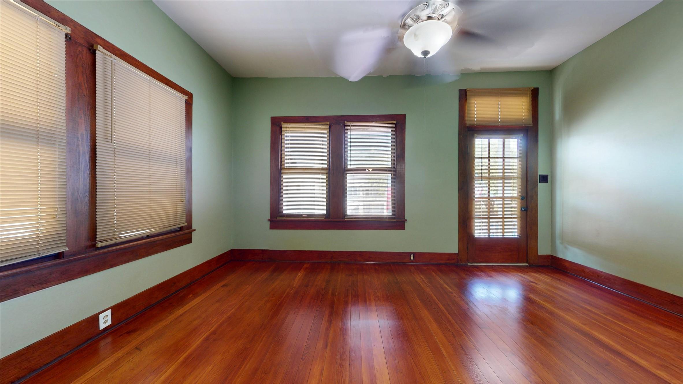 Image 3: Beautiful original hardwood floors, glass transom,