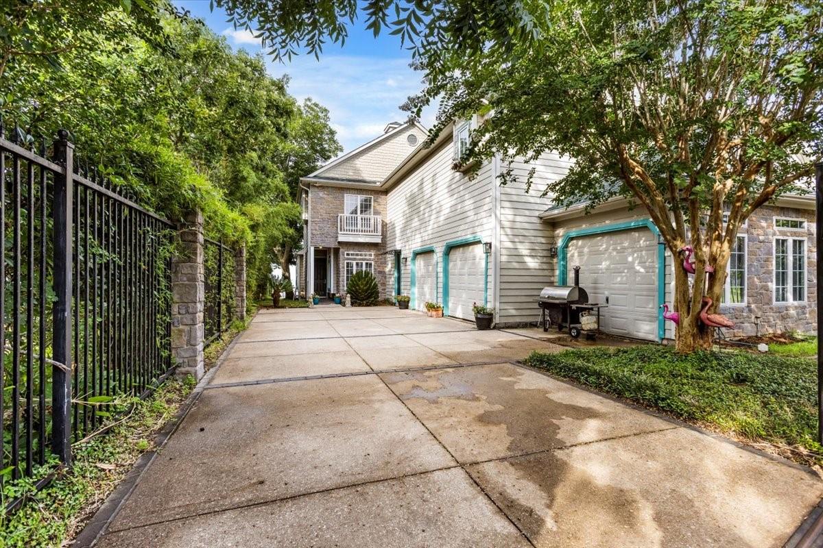 Image 3: Nestled behind a private gate, this home is the ul