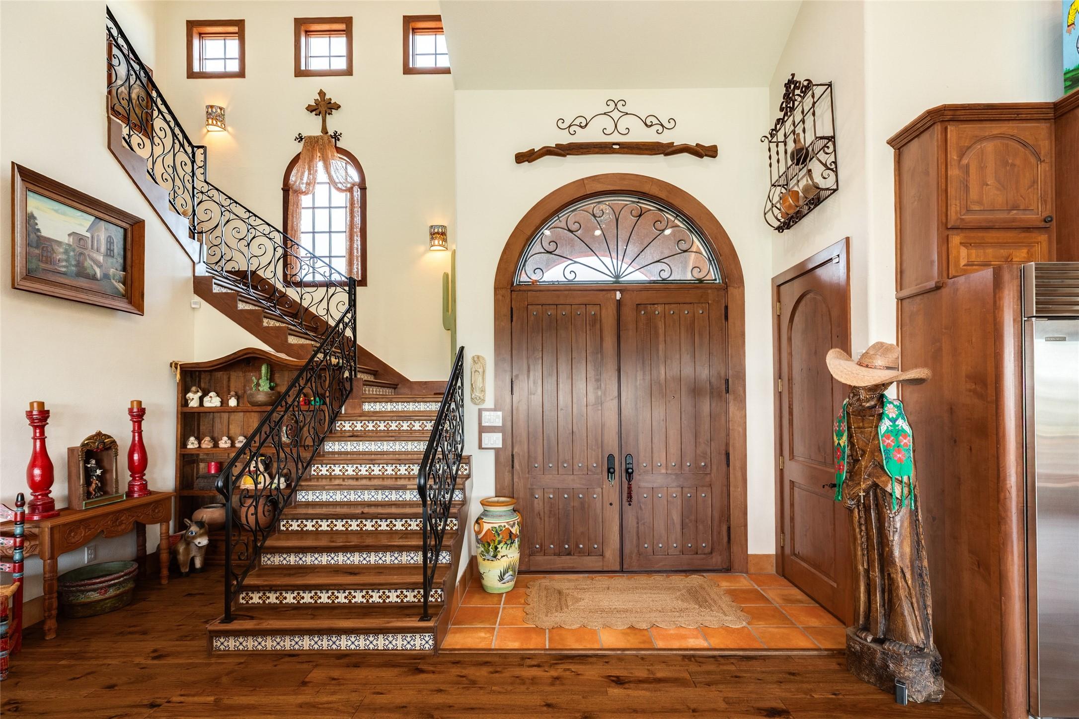Image 4: Front door and beautiful Spanish style steps with